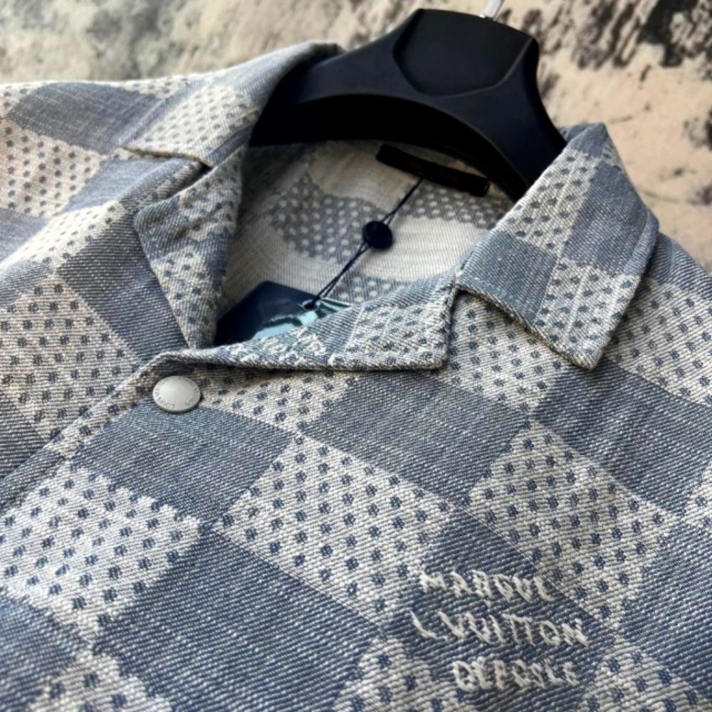 selling a matching designer outfit set — a short-sleeve button-up shirt a